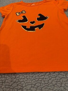 Celebrate Halloween Orange Pumpkin Face Tee with Black and Gold Accents